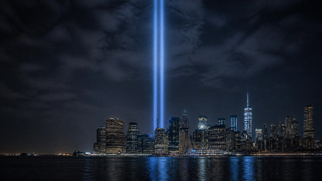 Solemn memorial beams against a quiet city skyline