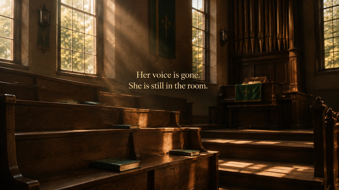 Empty wooden church pews in golden window light, with the overlay text: Her voice is gone. She is still in the room.